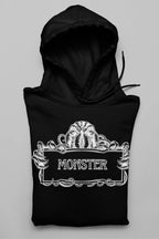 Black Monster Hooded Sweatshirt front close-up with white monster logo