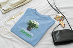 Light blue crewneck sweatshirt with tree graphic and 'Kindness Matters' print