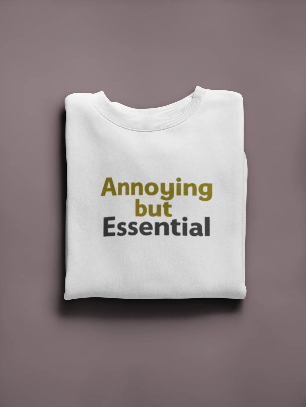 White unisex sweatshirt with 'Annoying but Essential' slogan text on front.