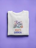 White crewneck sweatshirt with floral crest and 'Nelly's Garden' print.