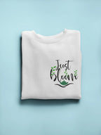White crewneck sweatshirt with front “Just Bloom” floral graphic