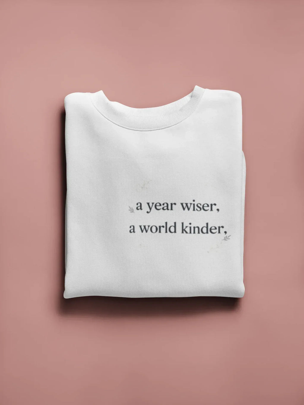 White crewneck sweatshirt with a year wiser, a world kinder print