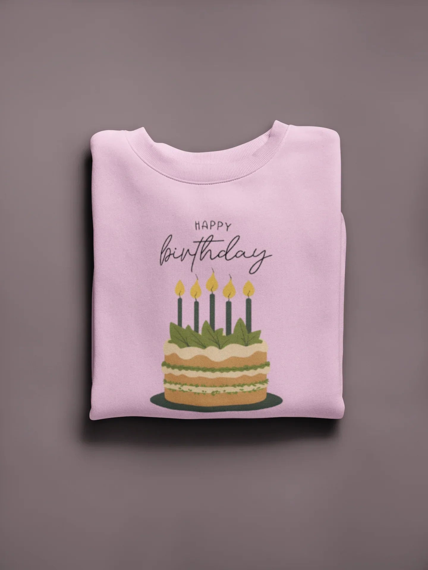 Light pink crewneck sweatshirt with “Happy birthday” cake and candle graphic