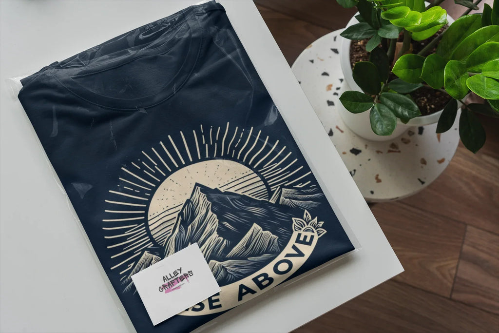 Navy short-sleeve T-shirt with mountain sunrise “RISE ABOVE” graphic