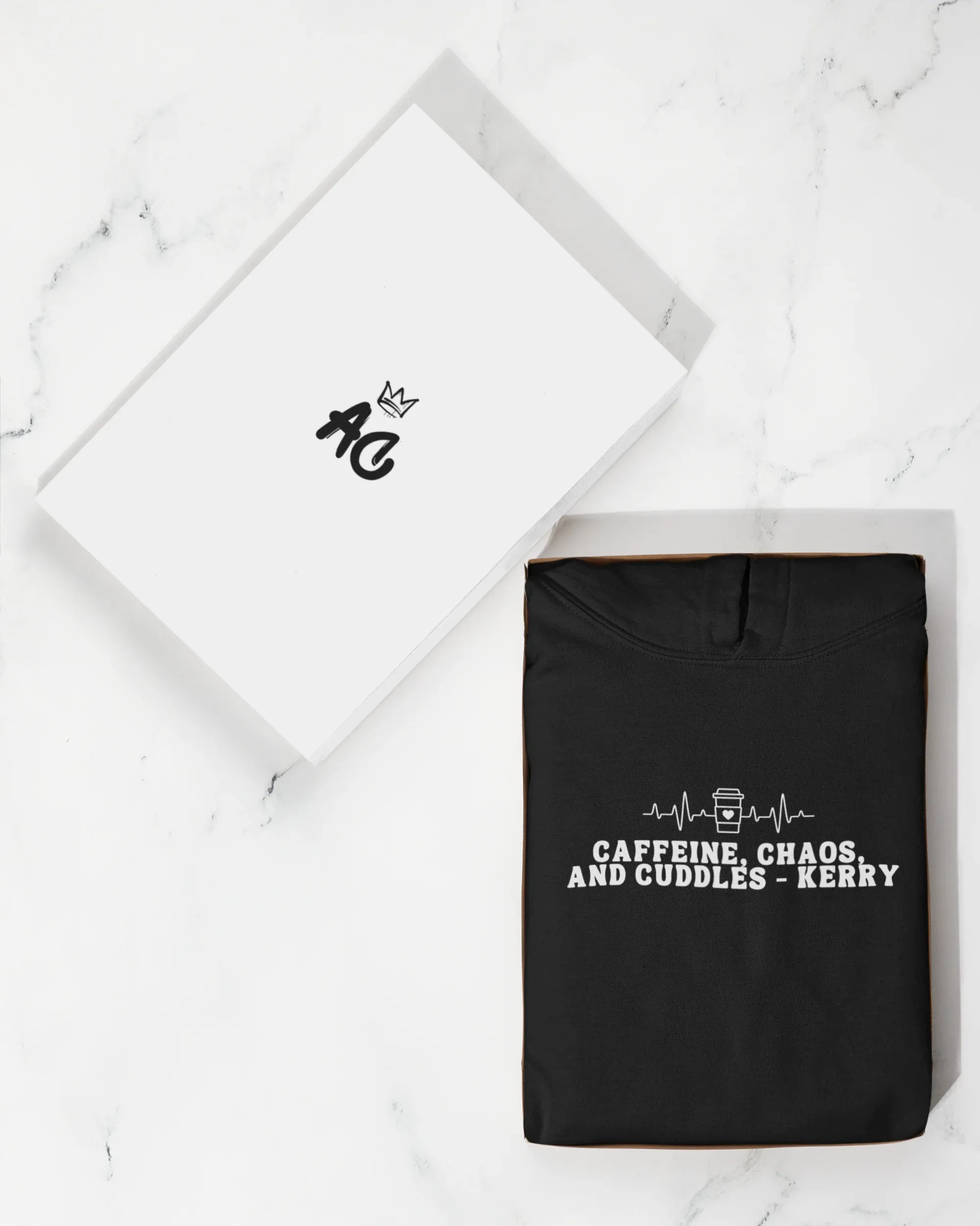 Black hoodie sweatshirt with 'Caffeine, Chaos, and Cuddles' front graphic