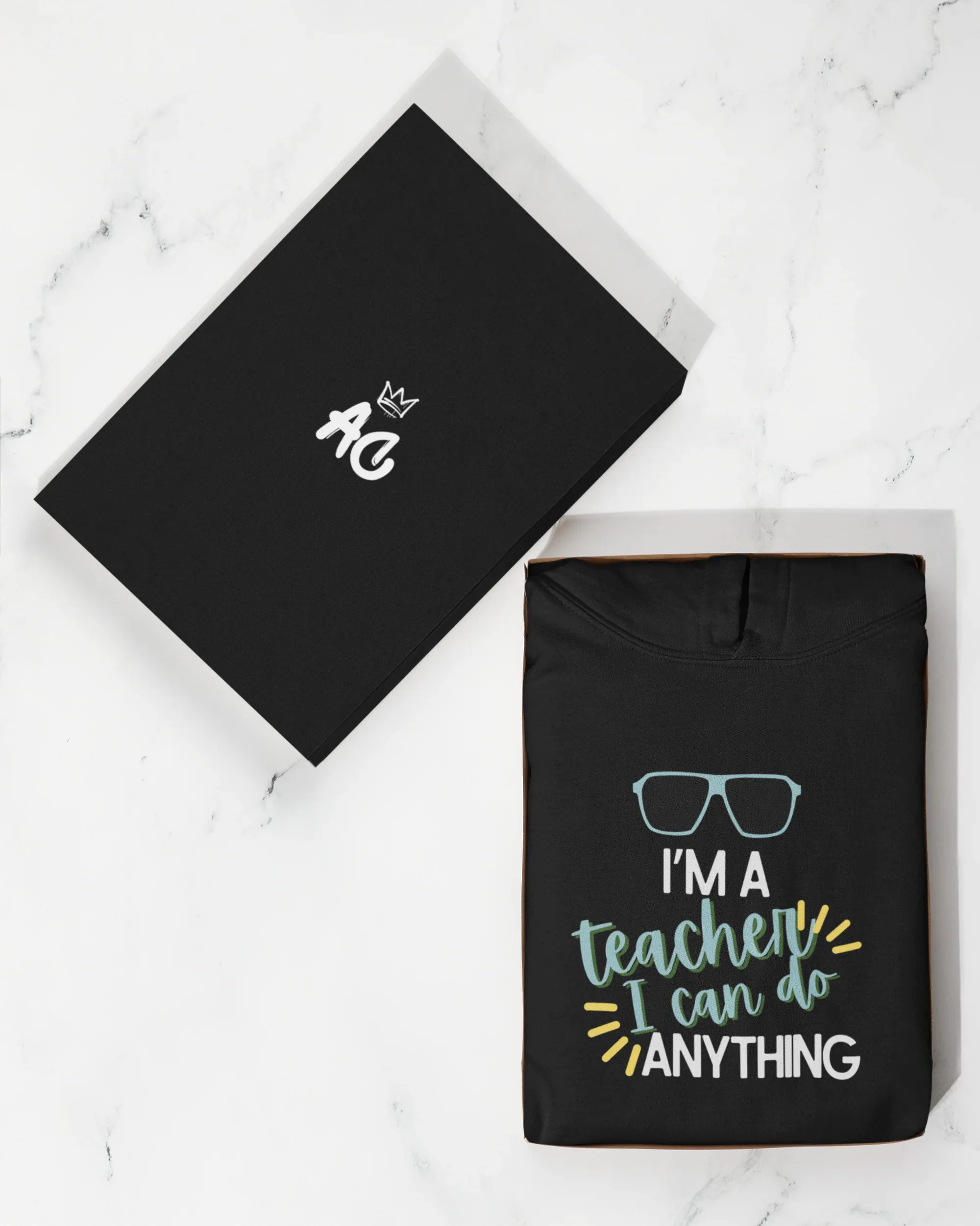 Black unisex hoodie with front teacher slogan print and hood