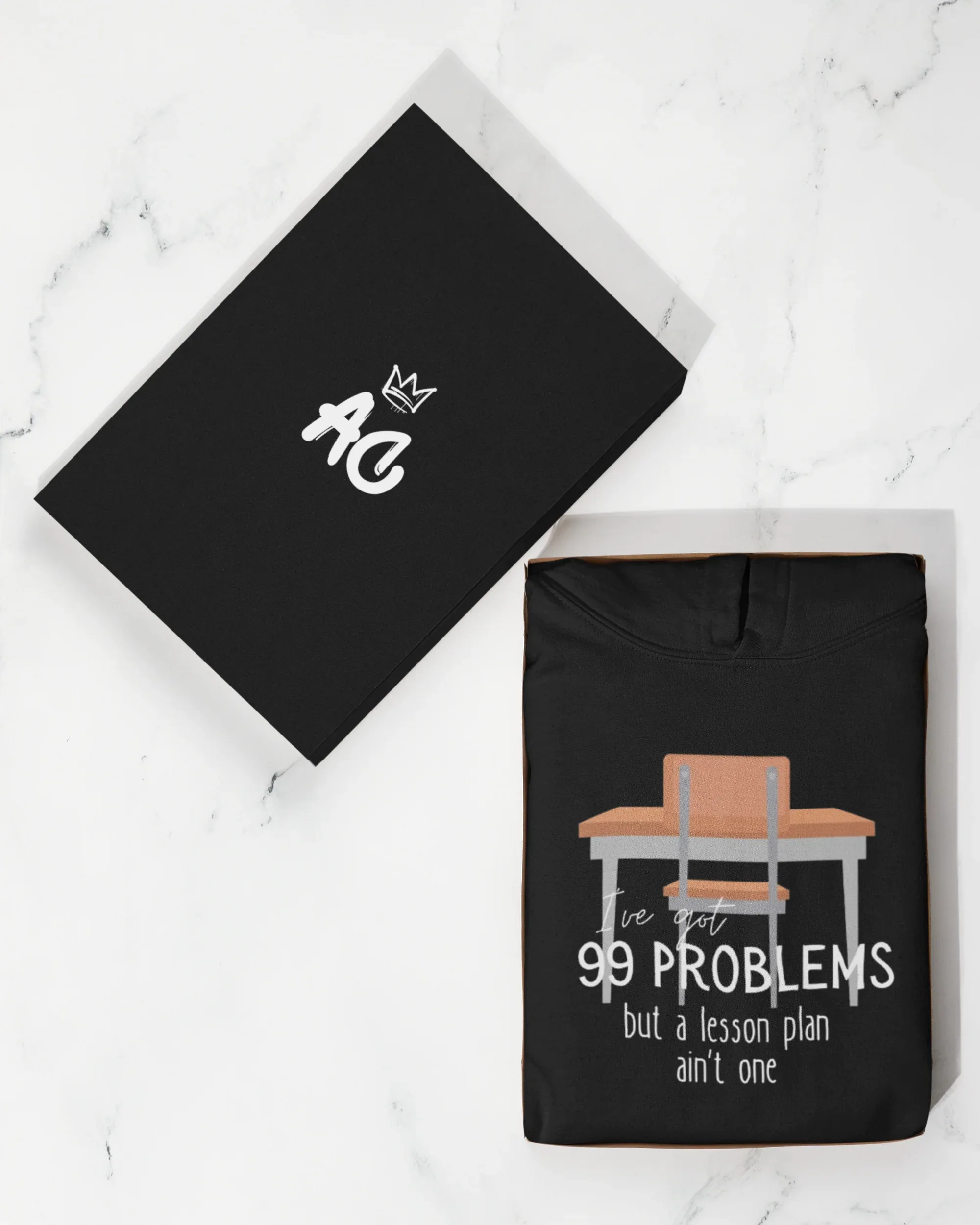 Unisex black hoodie with small crown logo and 99 problems desk print