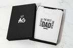 Folded white heavy cotton T-shirt in a black gift box, featuring “The Best Dad” graphic.