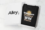 Black crewneck sweatshirt with “Wild hearts Protect Wild Places” graphic on chest