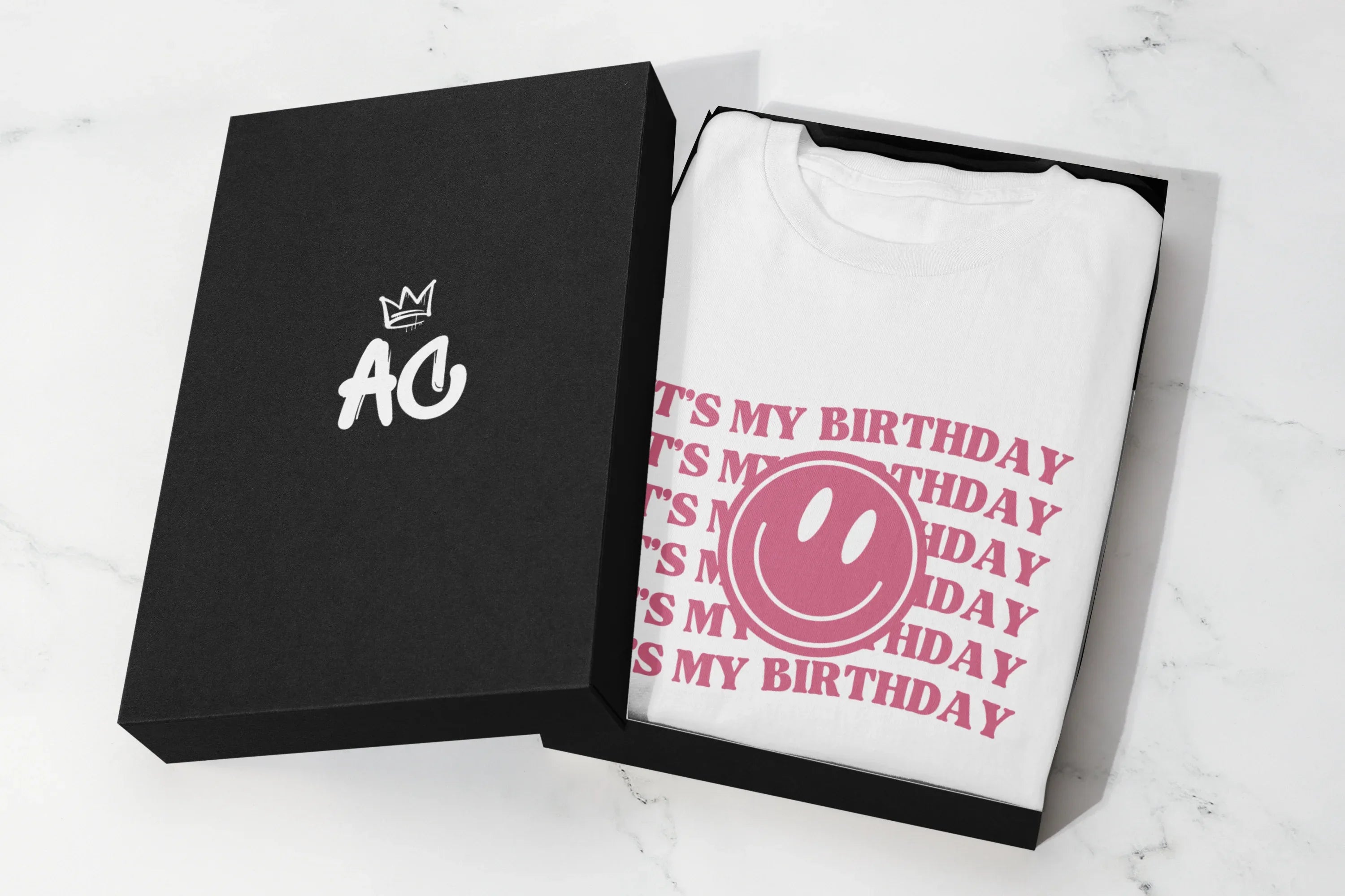 White hooded sweatshirt in open gift box with birthday graphic on front