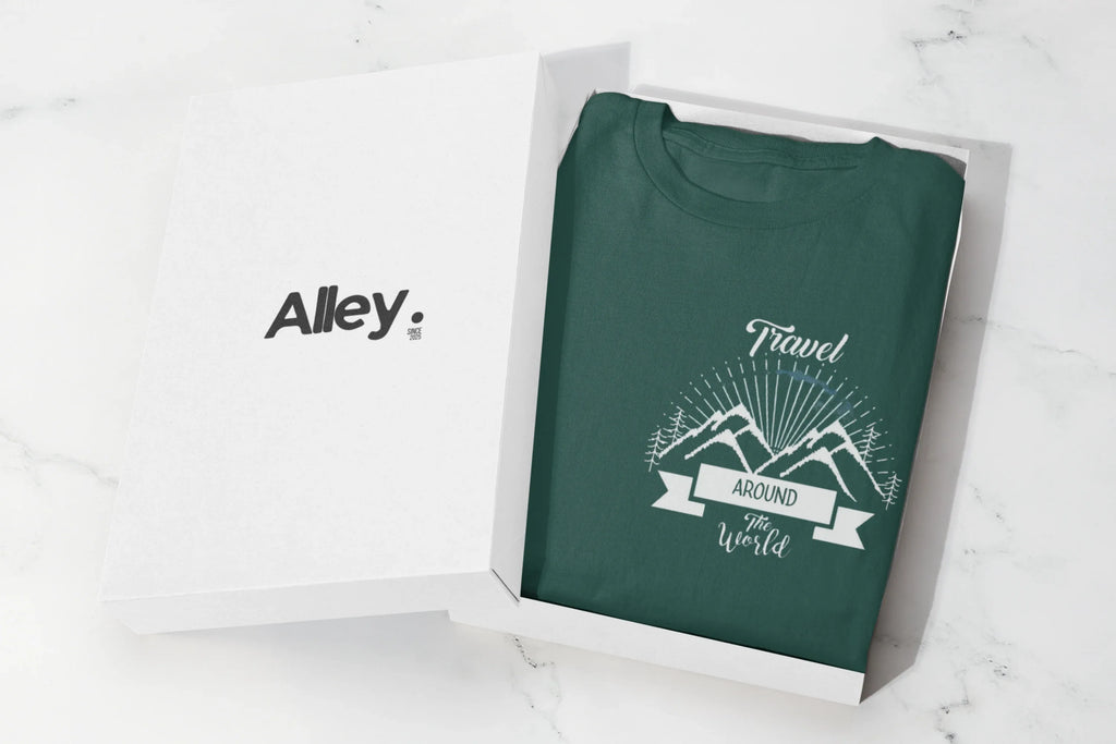Folded green crewneck sweatshirt with centered chest adventure graphic
