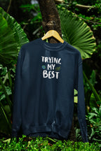 Deep teal crewneck sweatshirt with "Trying My Best" text graphic on the front
