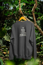 Charcoal gray sweatshirt back view with 'I'm Trying to Be a Nature Person' text