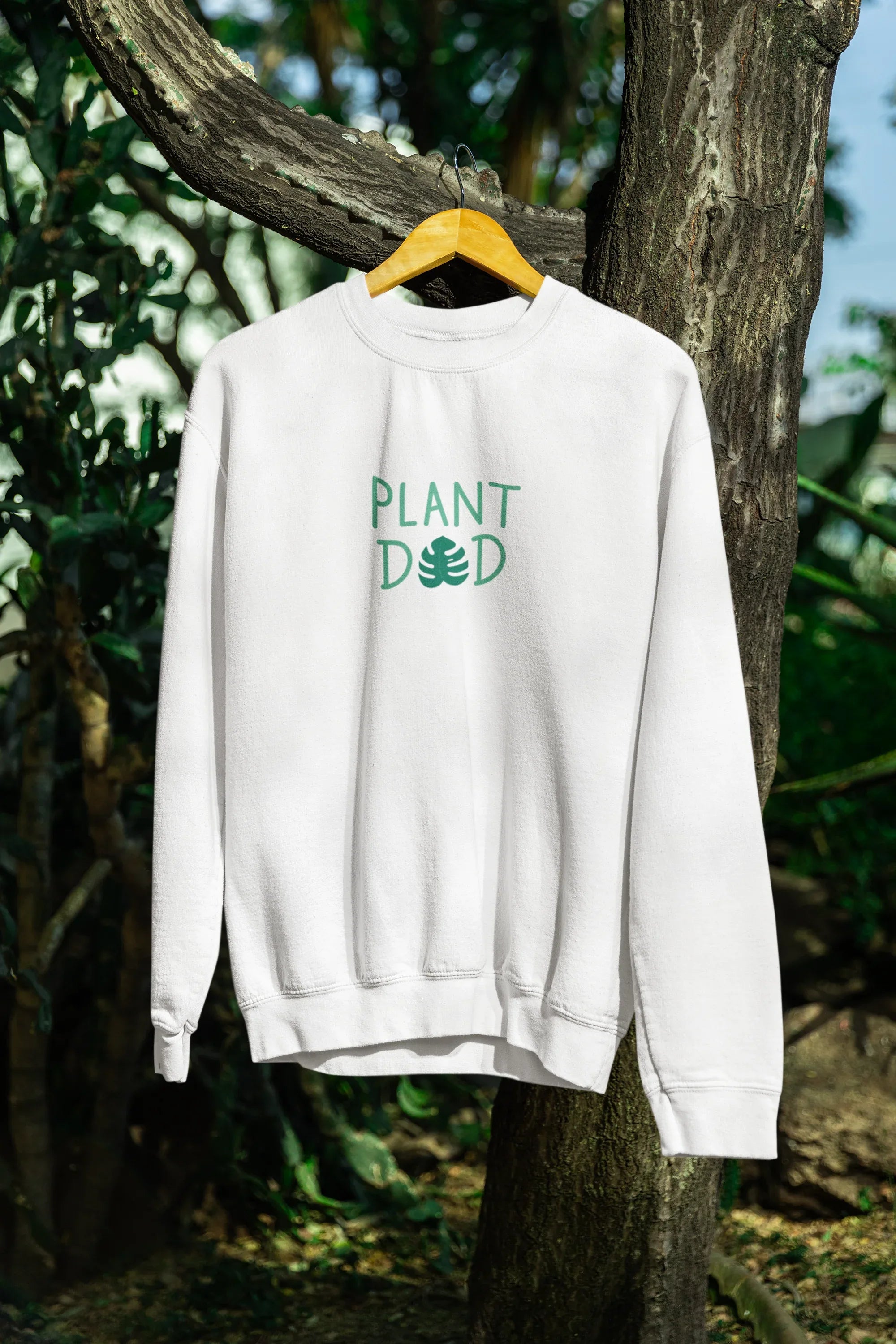 Arctic white crewneck sweatshirt with Plant Dad graphic on the back, long sleeves