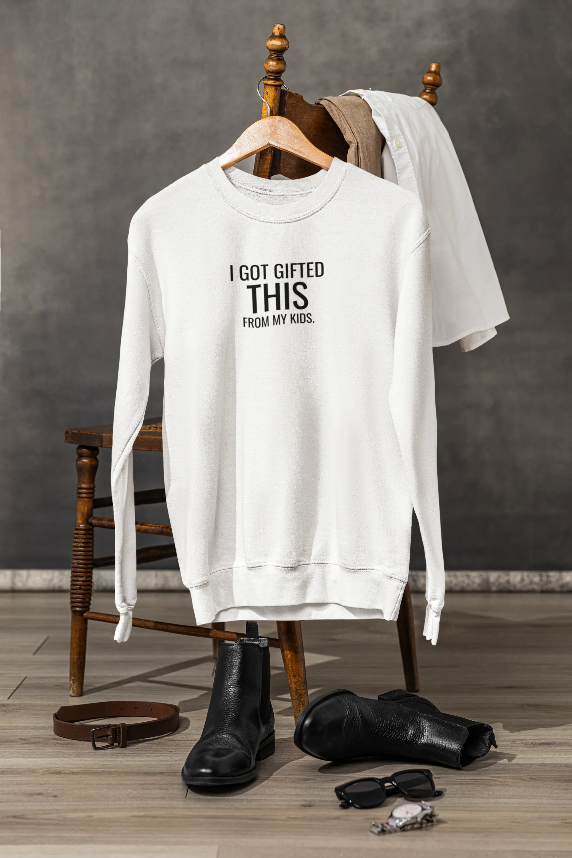 White crewneck sweatshirt with "I got gifted this" and "from my kids" chest print