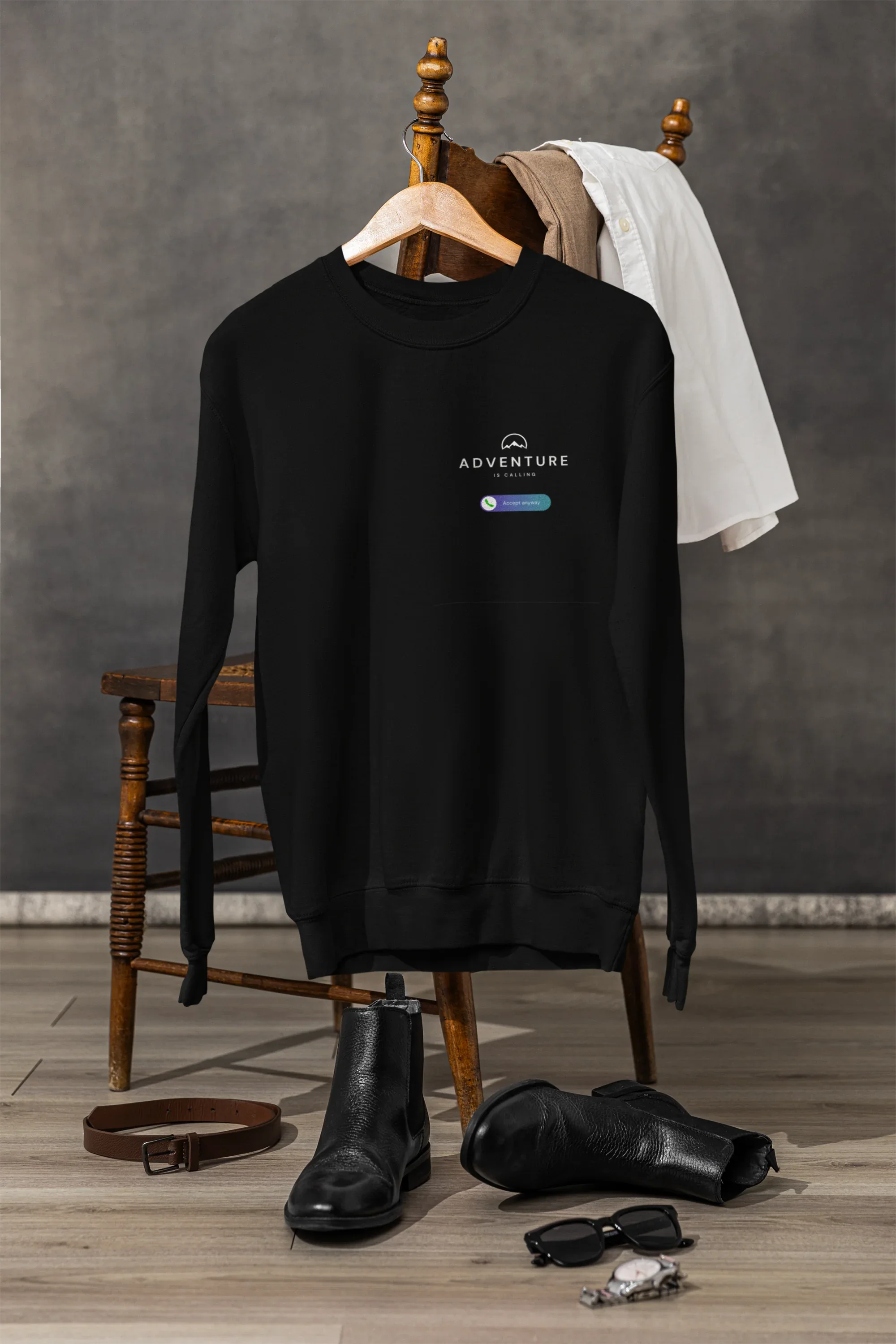 Black sweatshirt on display, Adventure logo graphic on front