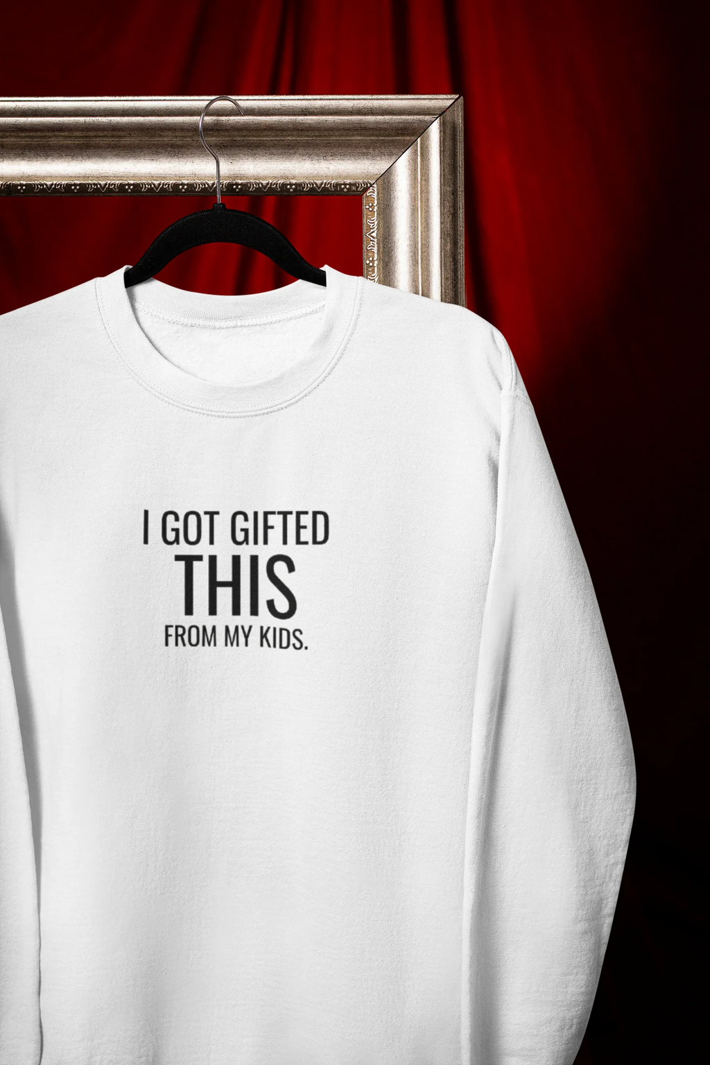 White sweatshirt with crew neck and "I got gifted this" chest print