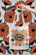 Heart-print tote bag with tan heart graphic and multicolor diamonds, white canvas, cream handles
