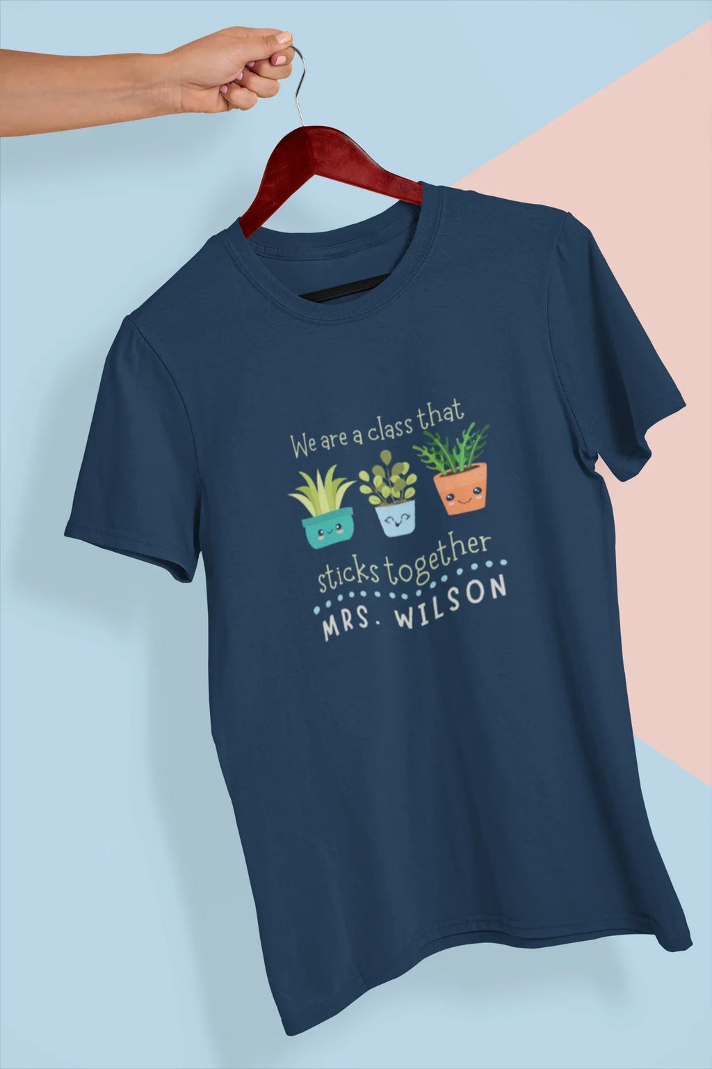 Navy teacher t-shirt hanging view with cartoon plants and front text graphic