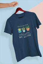 Navy teacher t-shirt hanging view with cartoon plants and front text graphic