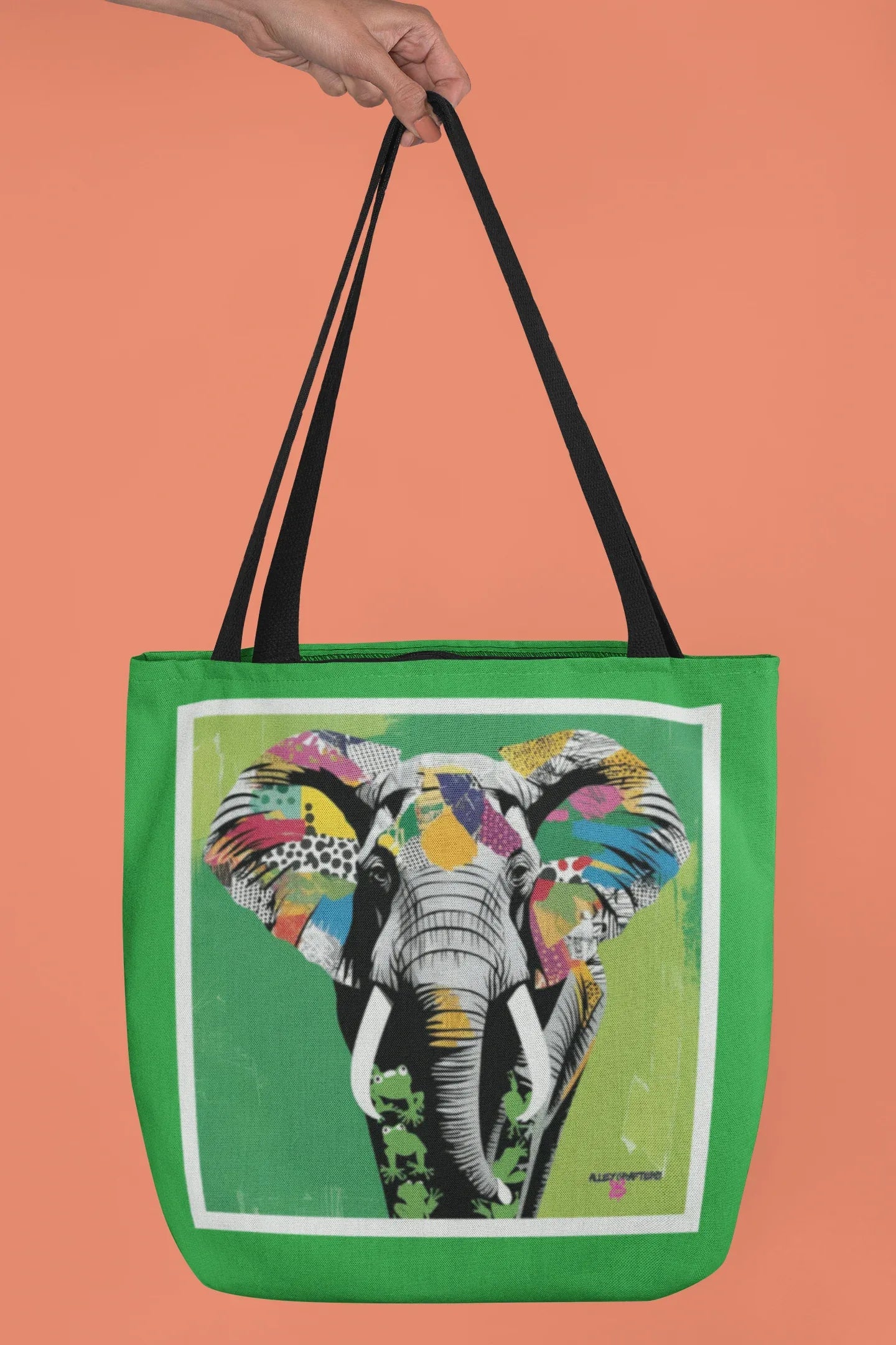 Green tote bag with elephant pop art graphic and black handles, front view