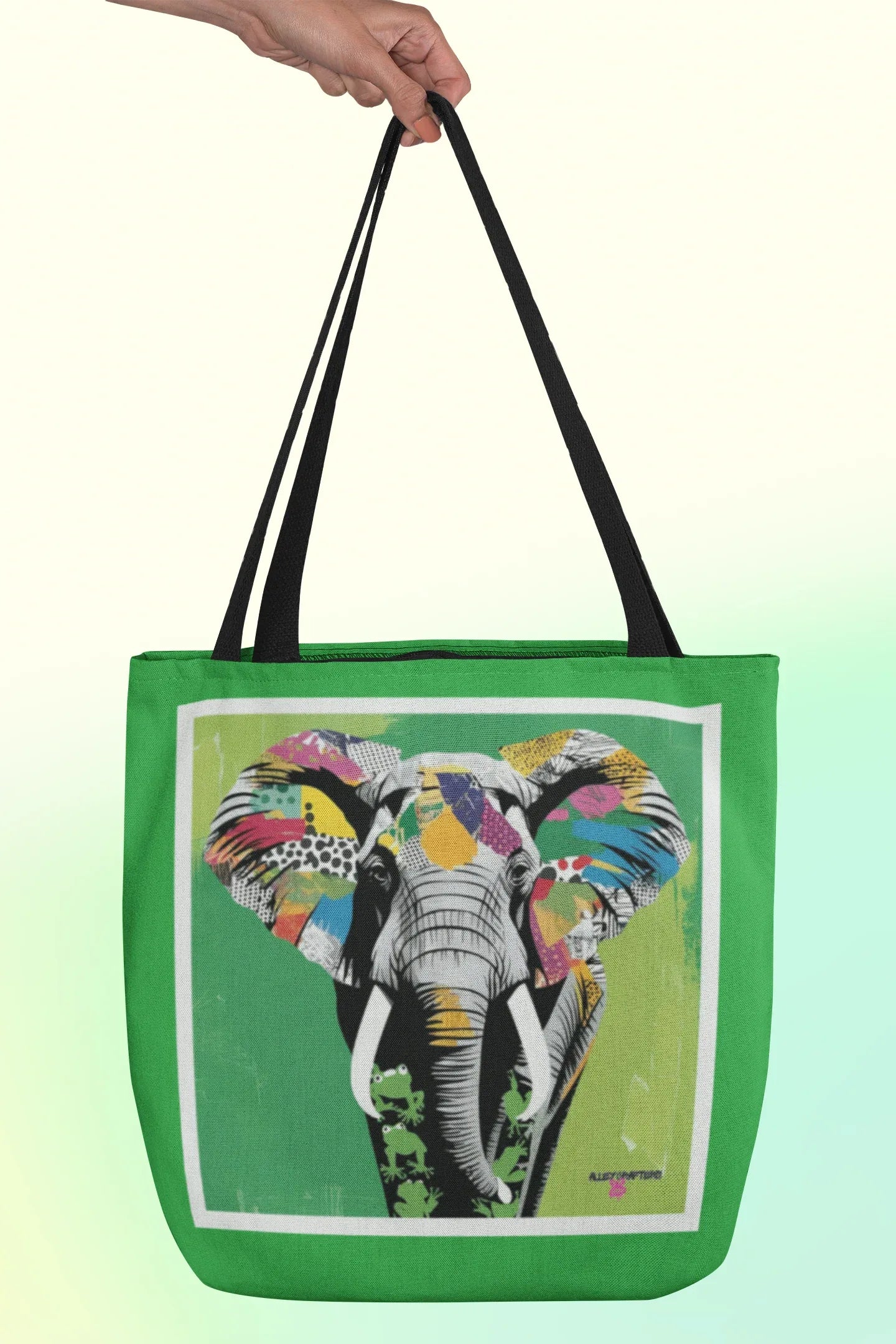 Green tote bag with elephant pop art image and black double top handles