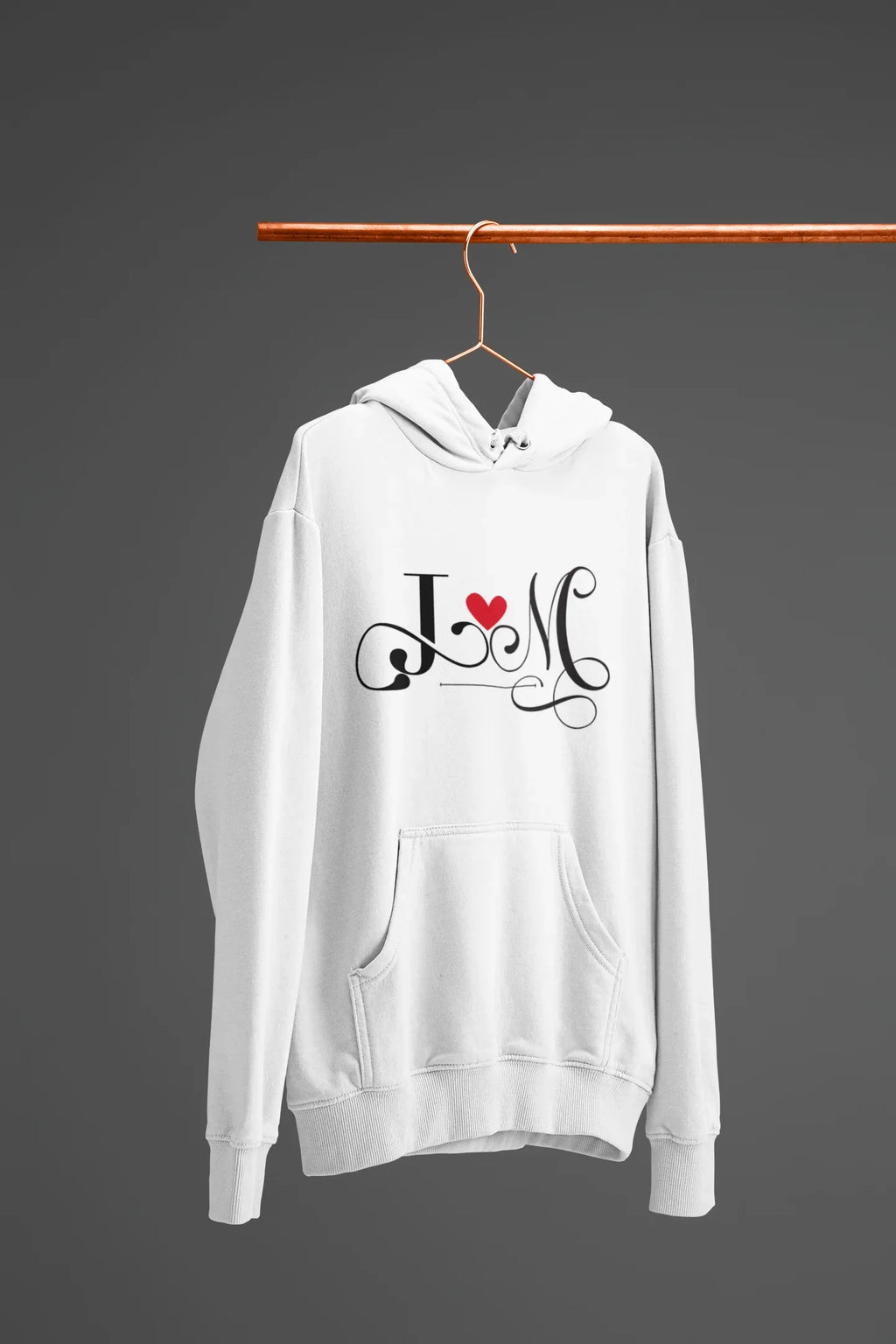 White hoodie with heart monogram graphic on chest, kangaroo pocket, drawstring hood