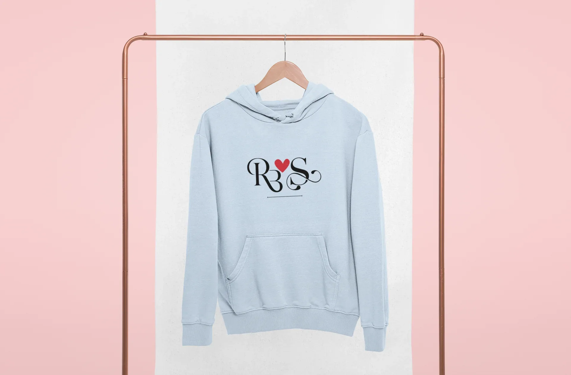 Light blue hoodie with heart monogram graphic on chest, kangaroo pocket, front view