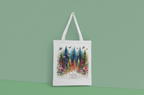 White tote bag with white handles, forest and birds graphic with Nature Trust logo