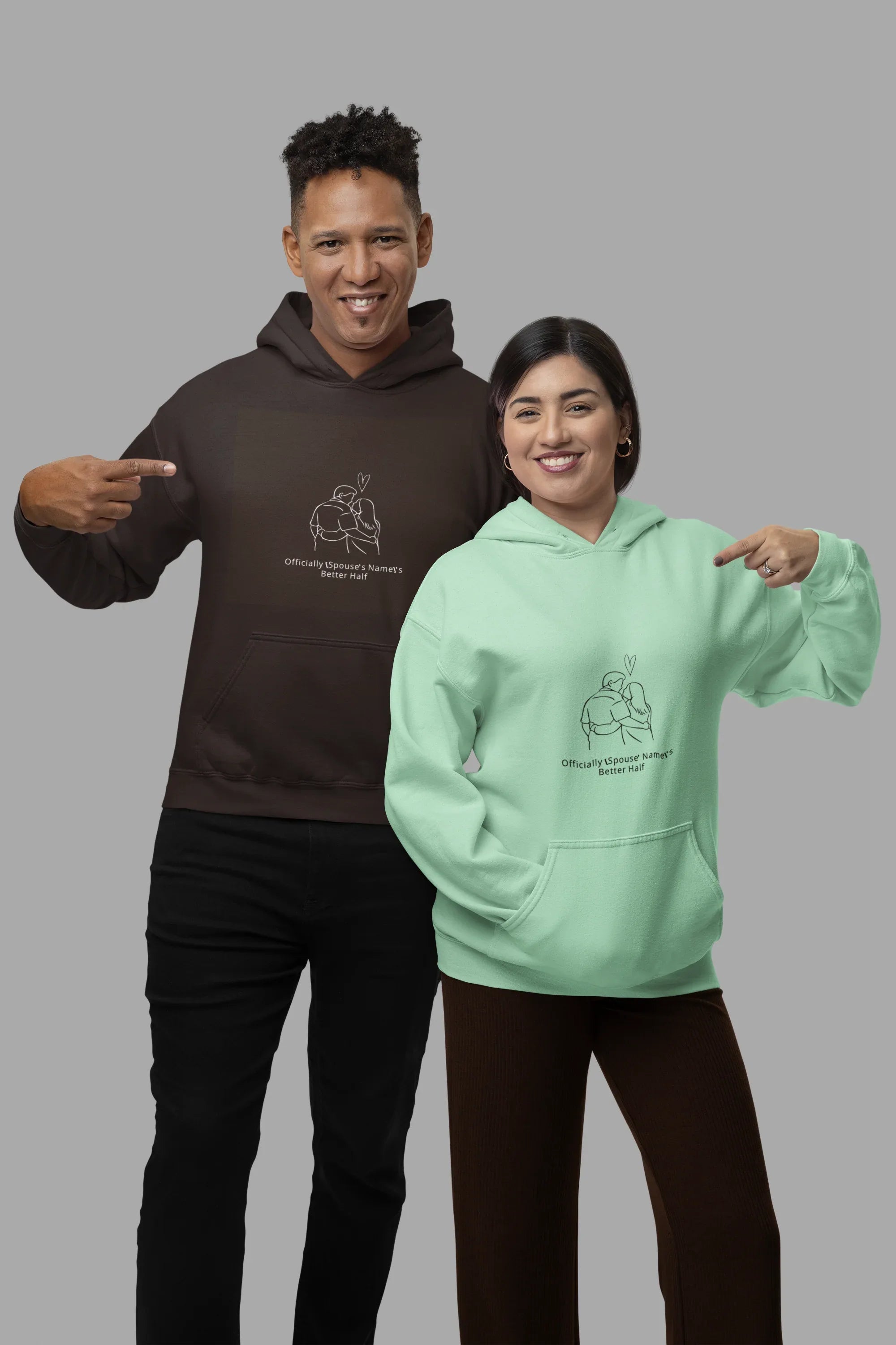 Dark chocolate hooded sweatshirt with couple graphic on chest, worn with pants