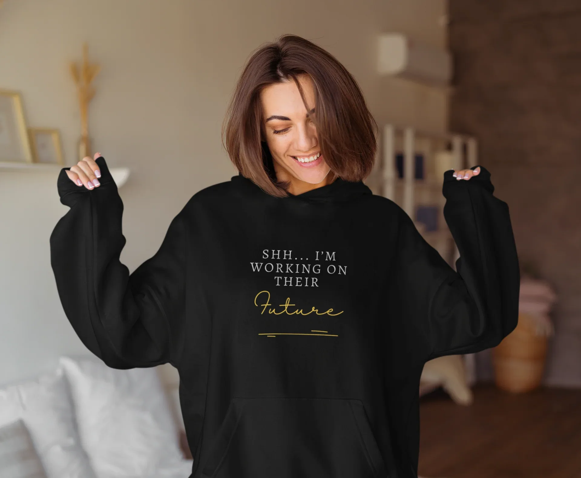 Black hooded sweatshirt with kangaroo pocket and 'Future' graphic on chest