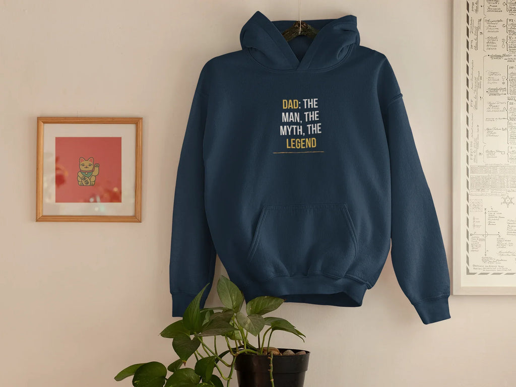 Navy hoodie hanging, featuring “DAD: THE MAN, THE MYTH, THE LEGEND” chest print
