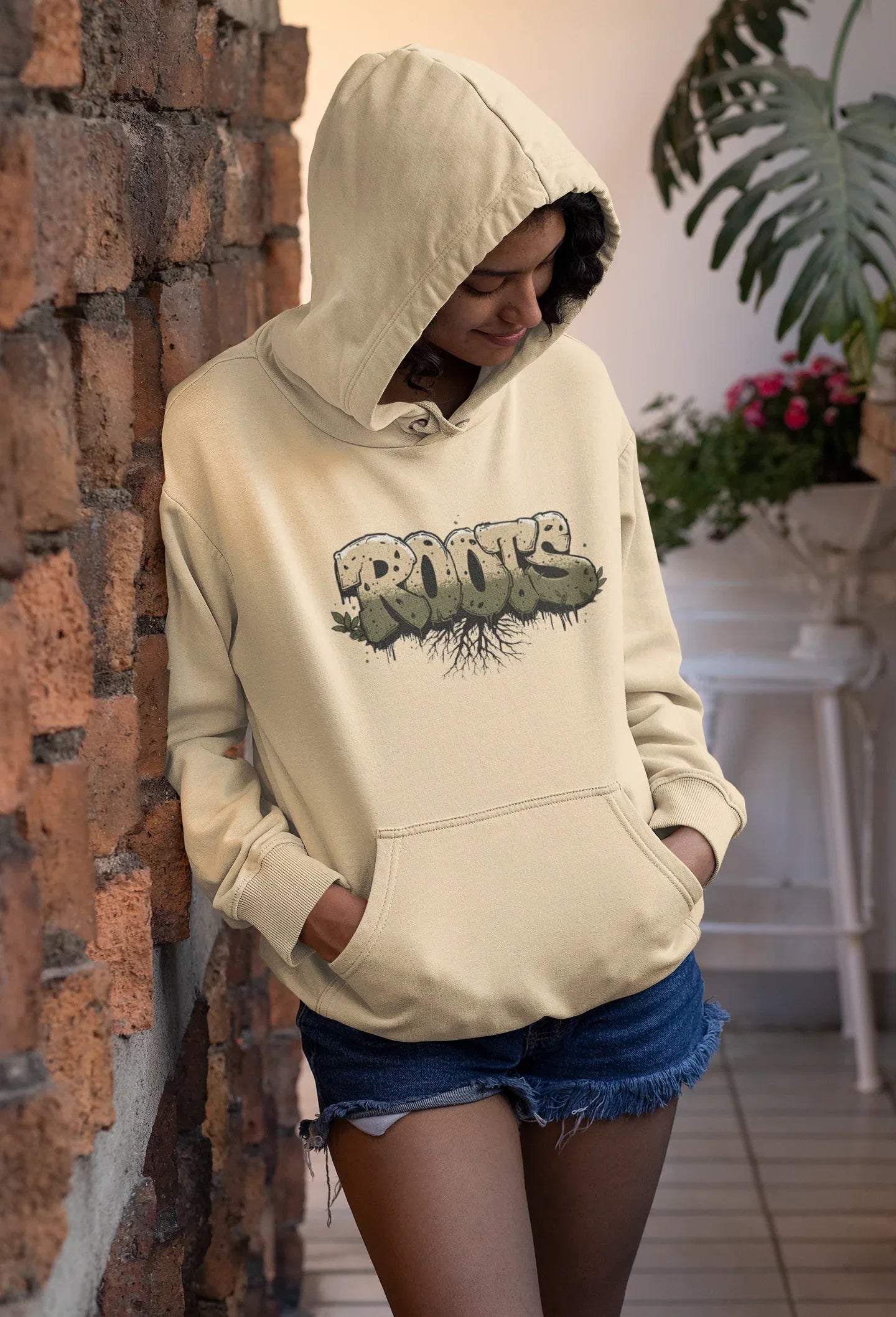 Light cream hoodie with hood and 'Roots' graphic front print, long sleeves