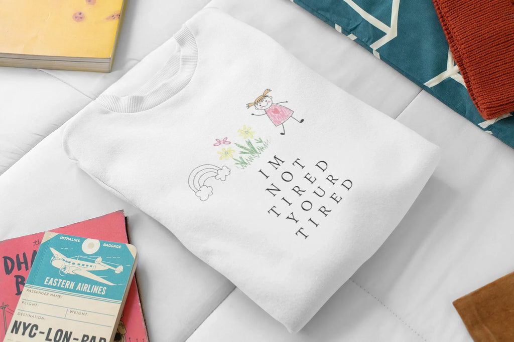 Arctic white kids sweatshirt with 'I'm Not Tired, You're Tired' character graphic