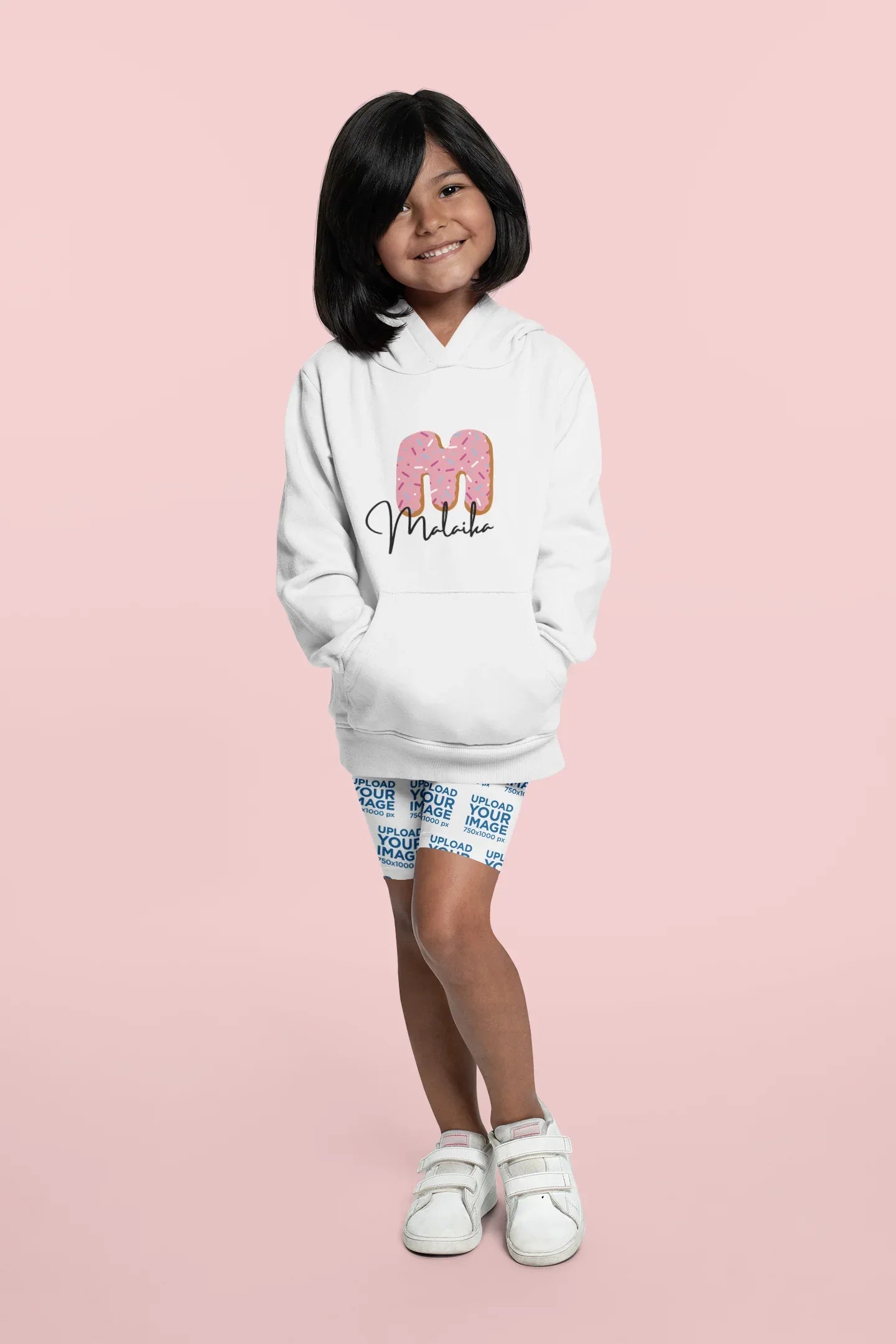 White kids hoodie with hood and kangaroo pocket, featuring a pink donut graphic on front.