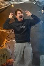 Man wearing a dark navy pullover hoodie with front pocket and hood drawstrings.