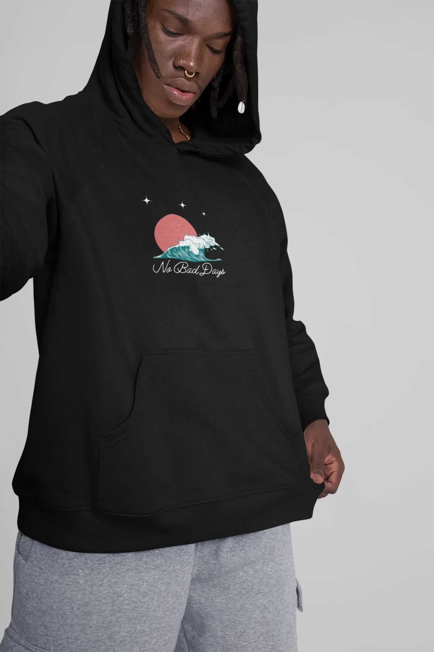 Black hooded sweatshirt on model, front pocket and No Bad Days graphic