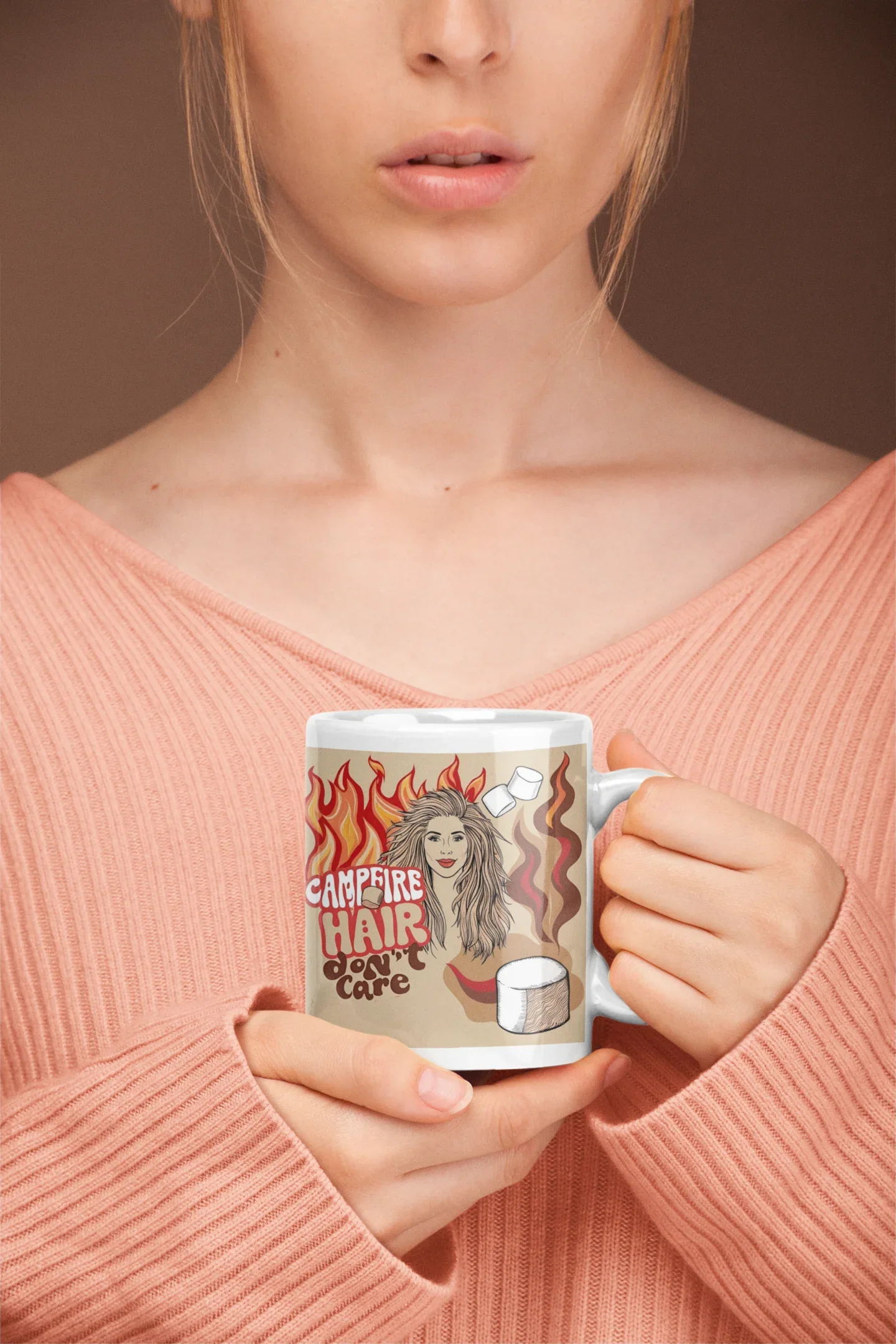 White ceramic mug with flame-haired woman and coffee cup graphic, held at chest
