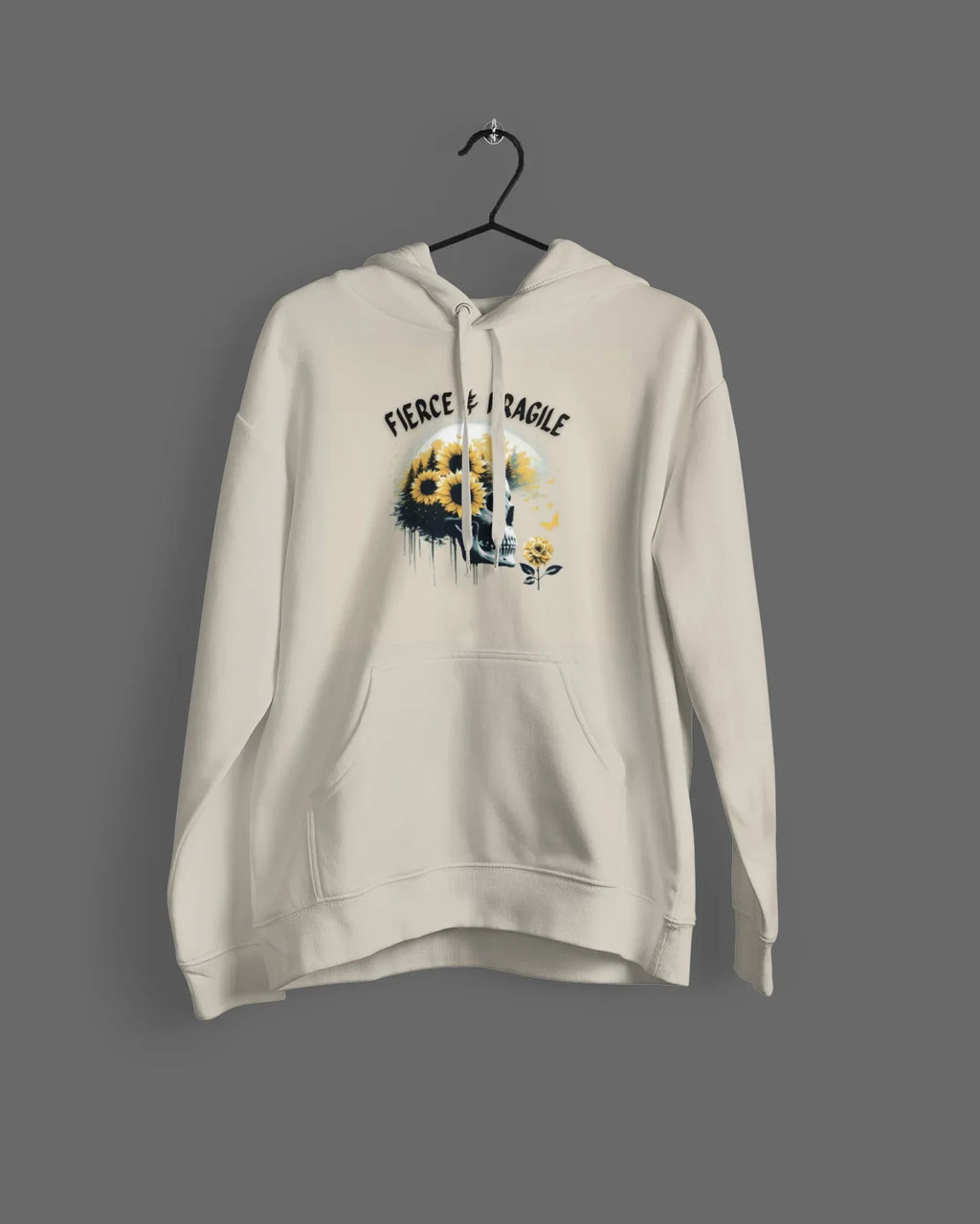 White hooded sweatshirt on hanger with front graphic skull and flower design, drawstring hood and pocket.