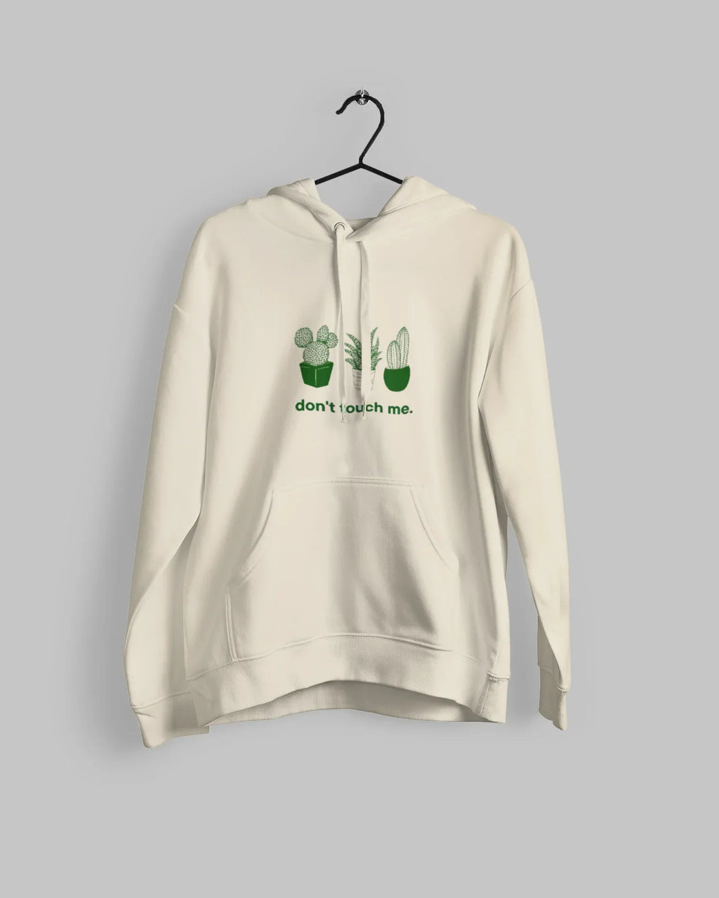 Light cream hoodie with cactus graphic and “don’t touch me.” text on the chest