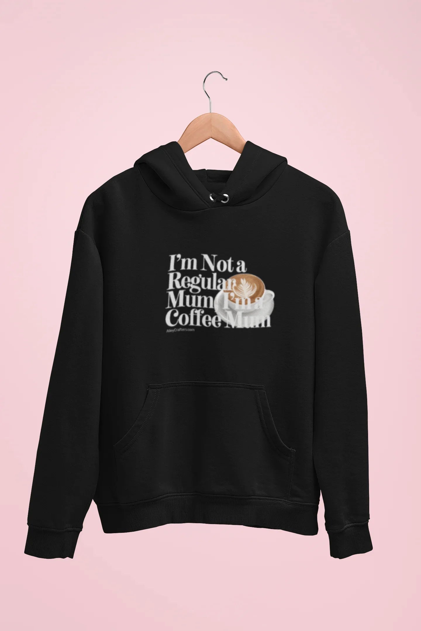 Black hoodie sweatshirt with hood, kangaroo pocket, and coffee mug “Not a Regular Mum” print