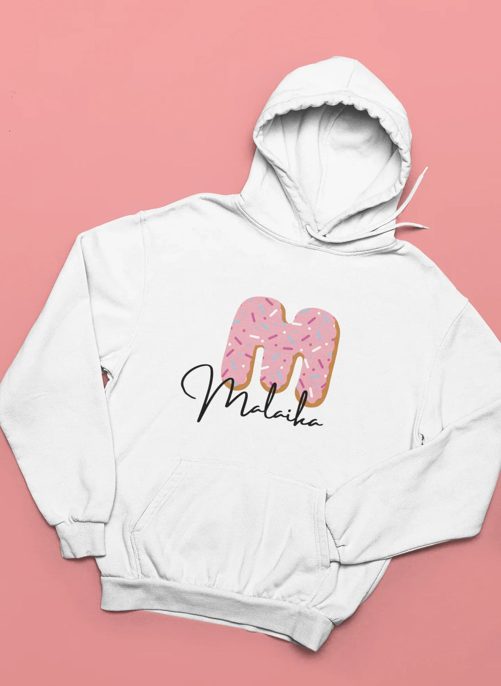 White kids hooded sweatshirt with pink donut graphic and name text at the center chest.