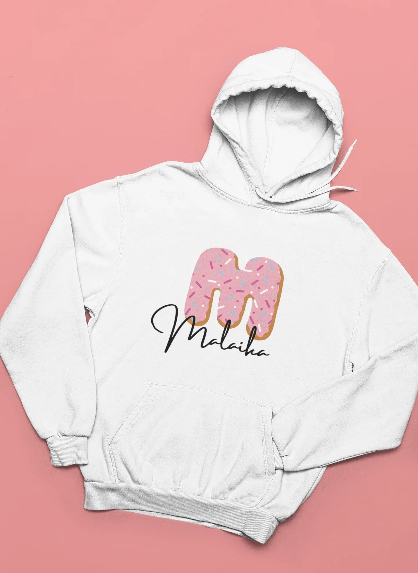 White kids hooded sweatshirt with pink donut graphic and name text at the center chest.