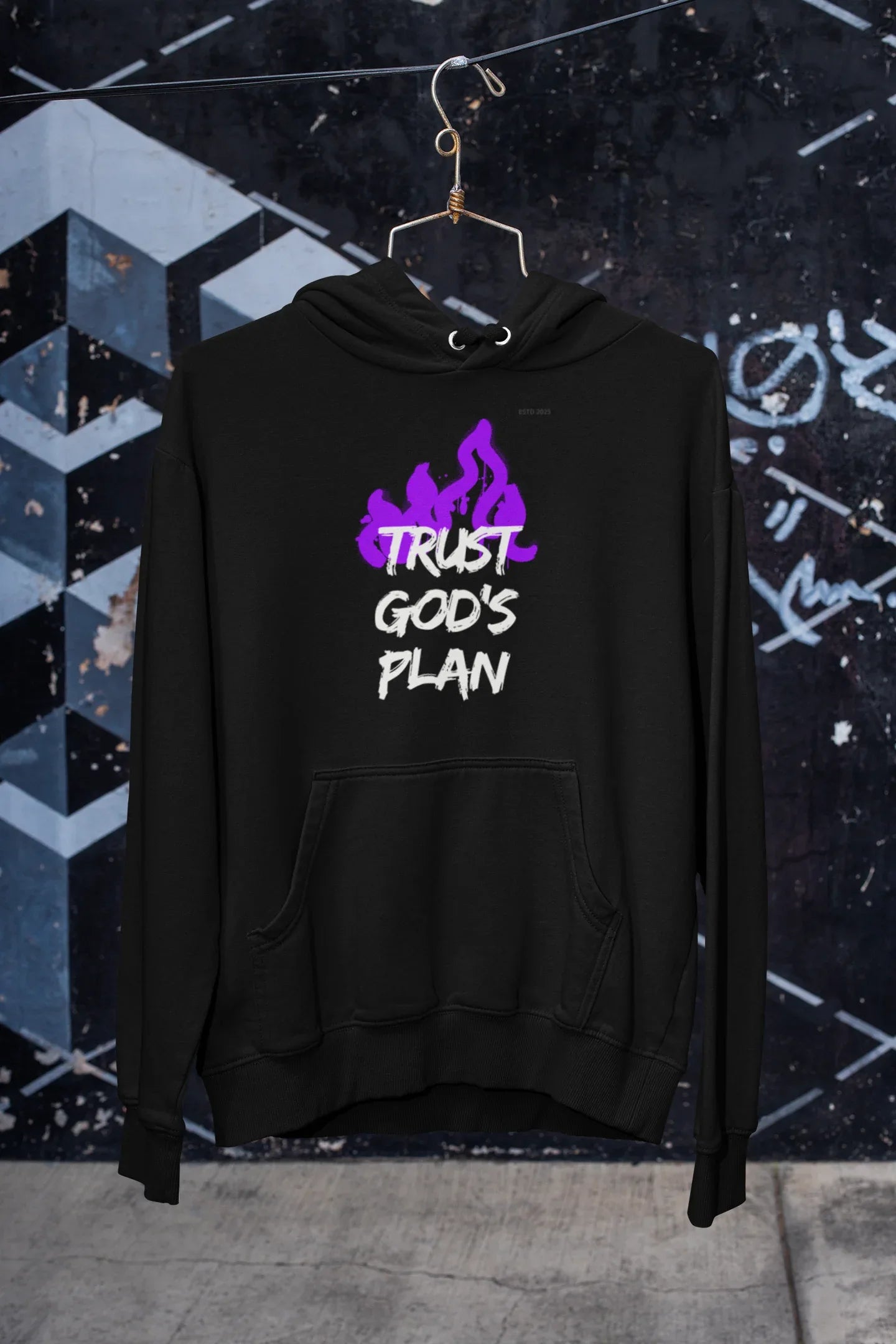 Black pullover hoodie with hood, pouch pocket, and purple flame-style text graphic.