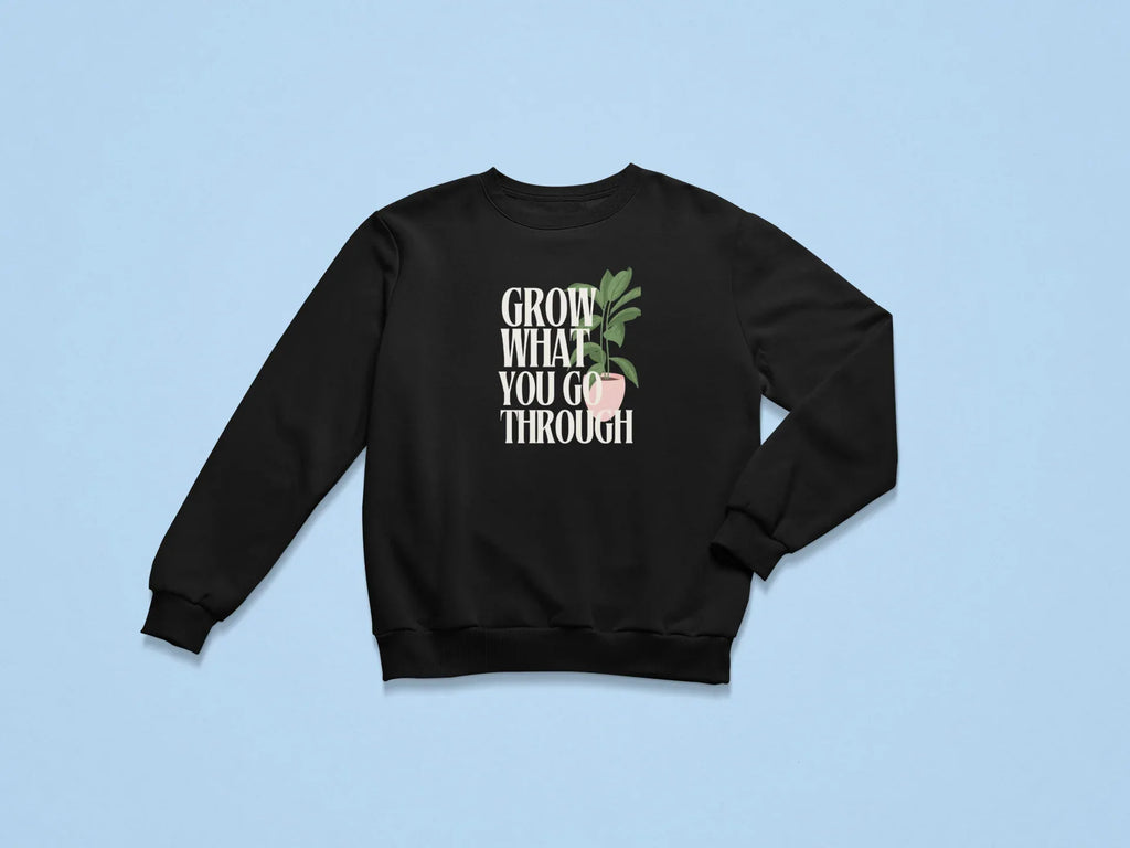 Black sweatshirt with front “Grow What You Go Through” graphic.