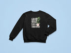 Black sweatshirt with front “Grow What You Go Through” graphic.