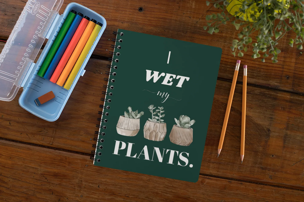A5 spiral notebook with green cover and “I wet my plants” typography plus succulent pot illustrations.