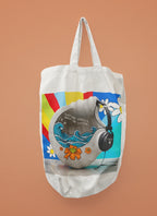 White tote bag with headphones and ocean wave graphic, long white handles