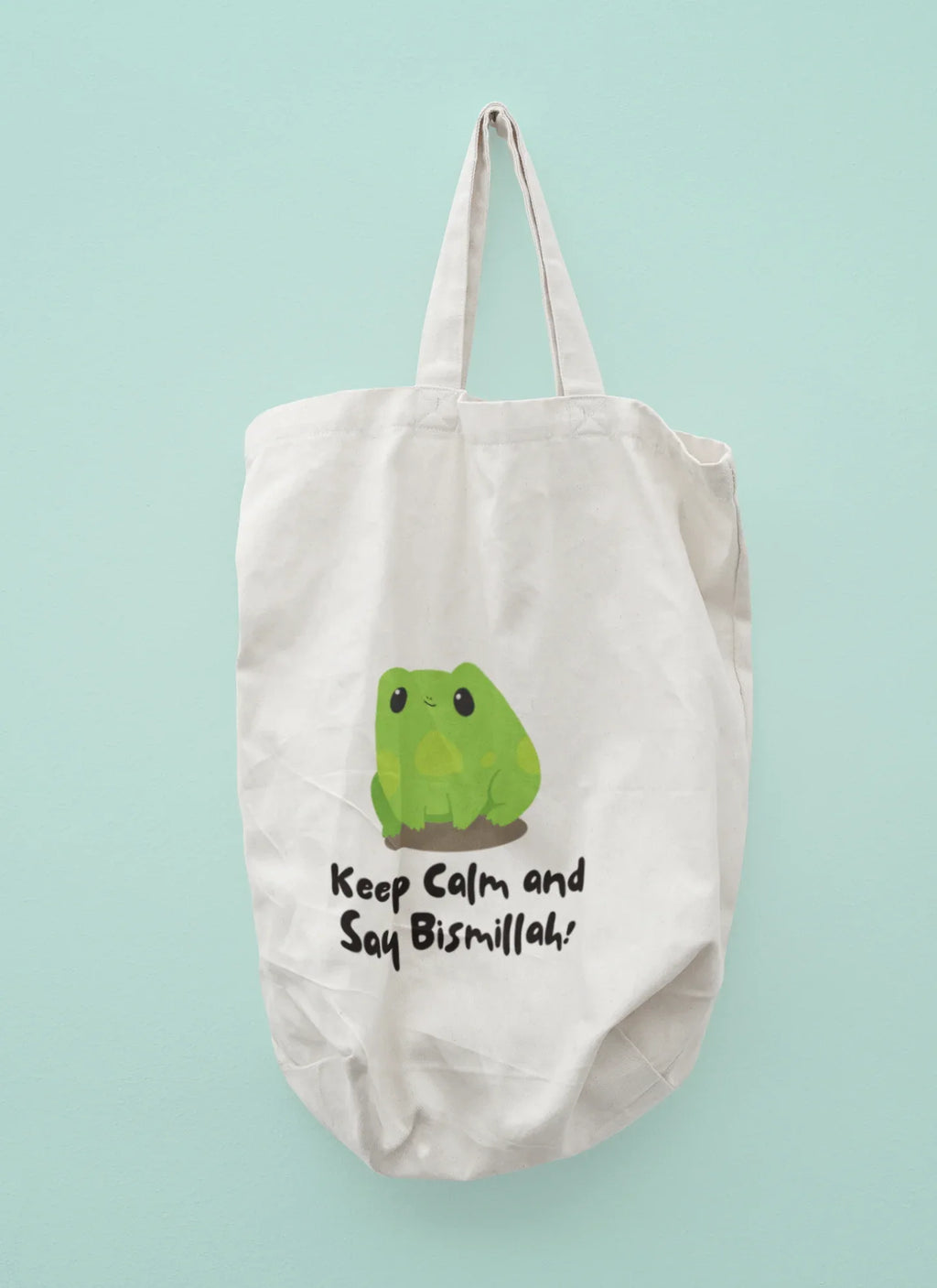 White cotton tote bag with frog graphic and slogan “Keep Calm and Say Bismillah!”