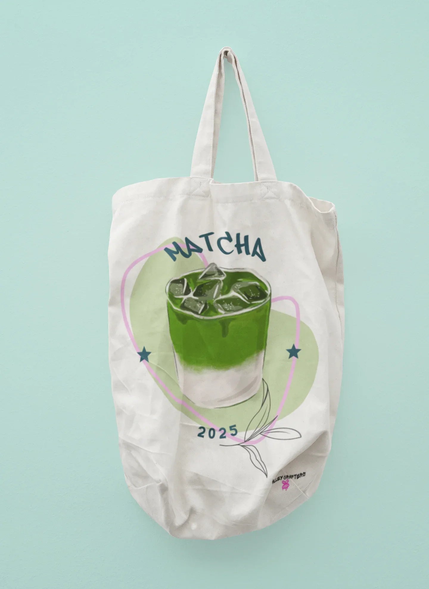 Off-white tote bag with 'MATCHA' print and green matcha drink graphic, stars